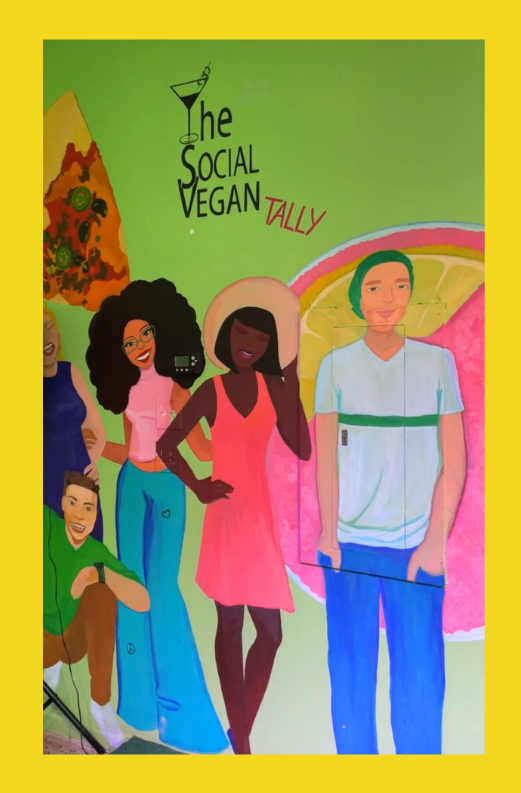 This is a photo of a wall in The Social Vegan--it's a nice mural.